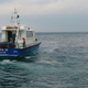 Singapore’s Maritime and Port Authority treating the spill site, with Oriental Pioneer in the background.